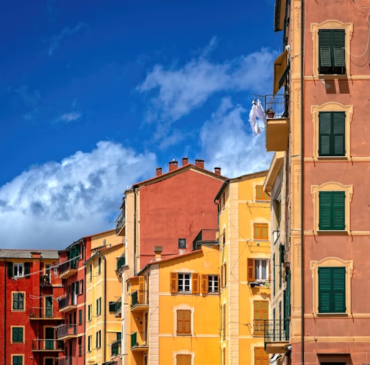 yellow and brown concrete building under cloudy sky in Camogli Italy