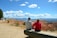 A happy French couple enjoying a scenic tour at the Grand Canyon with a guide.