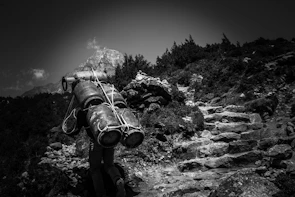 A person outdoors using a vayuo2 oxygen can during a sunny day hike.