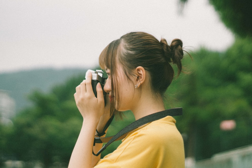 woman using camera