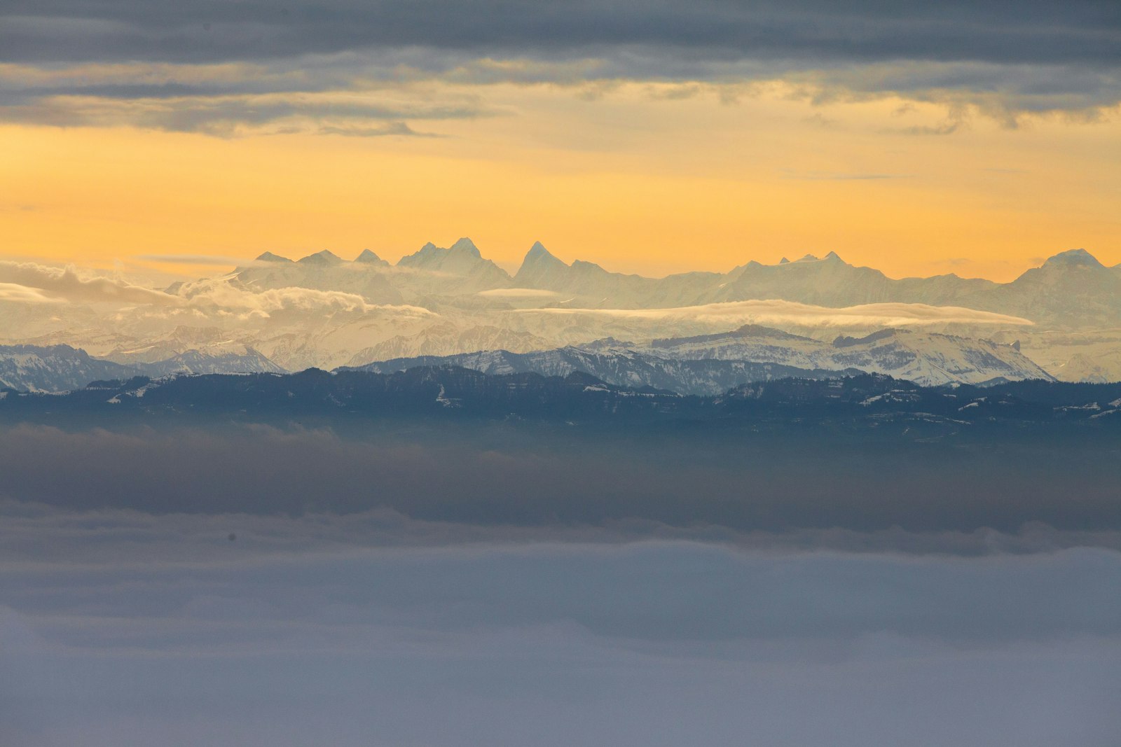 Canon EOS 5D Mark II + Canon EF 70-200mm F2.8L IS II USM sample photo. Mountains under gray sky photography