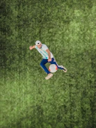 A soccer influencer creating engaging content on the field.