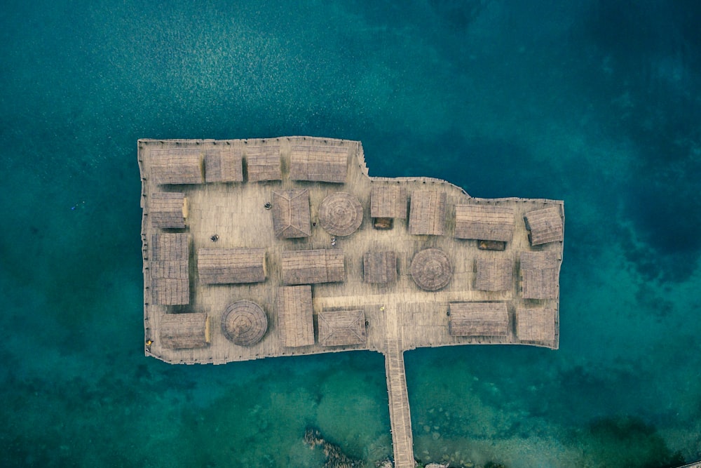 aerial view of wooden houses surrounded by body of water