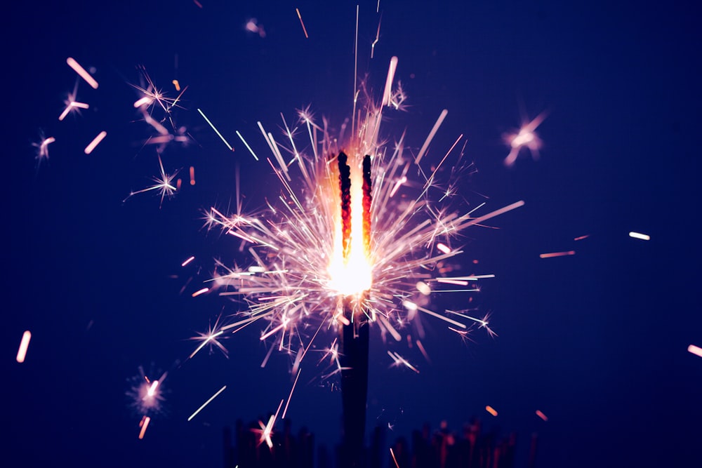 time-lapse photography of sparkler at night time
