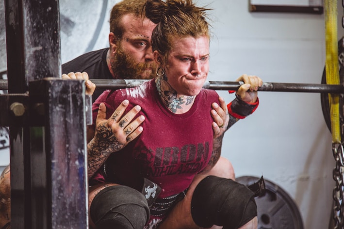 woman carrying barbells