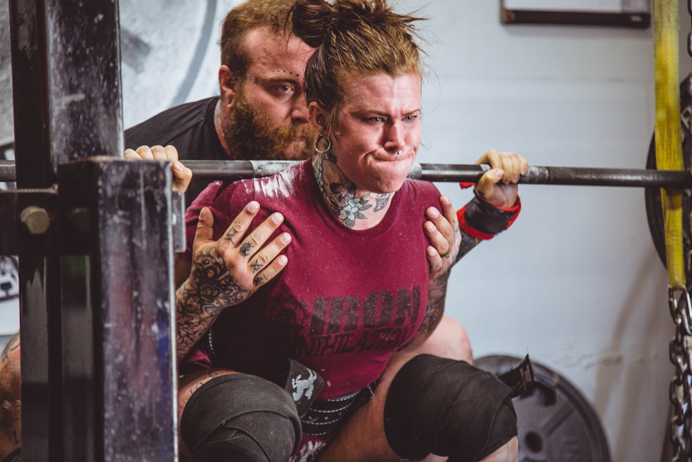 woman carrying barbells