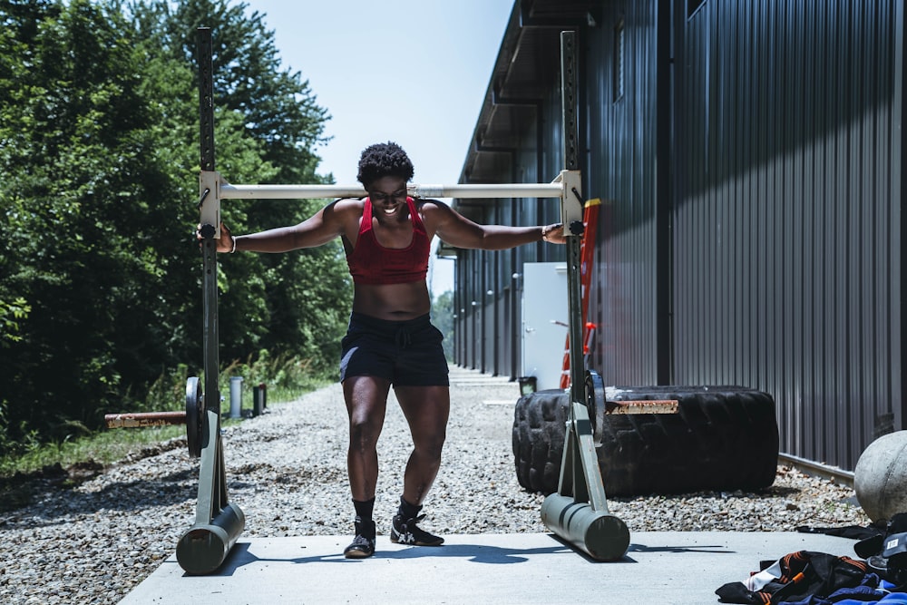 woman carrying white gym equipment at daytime