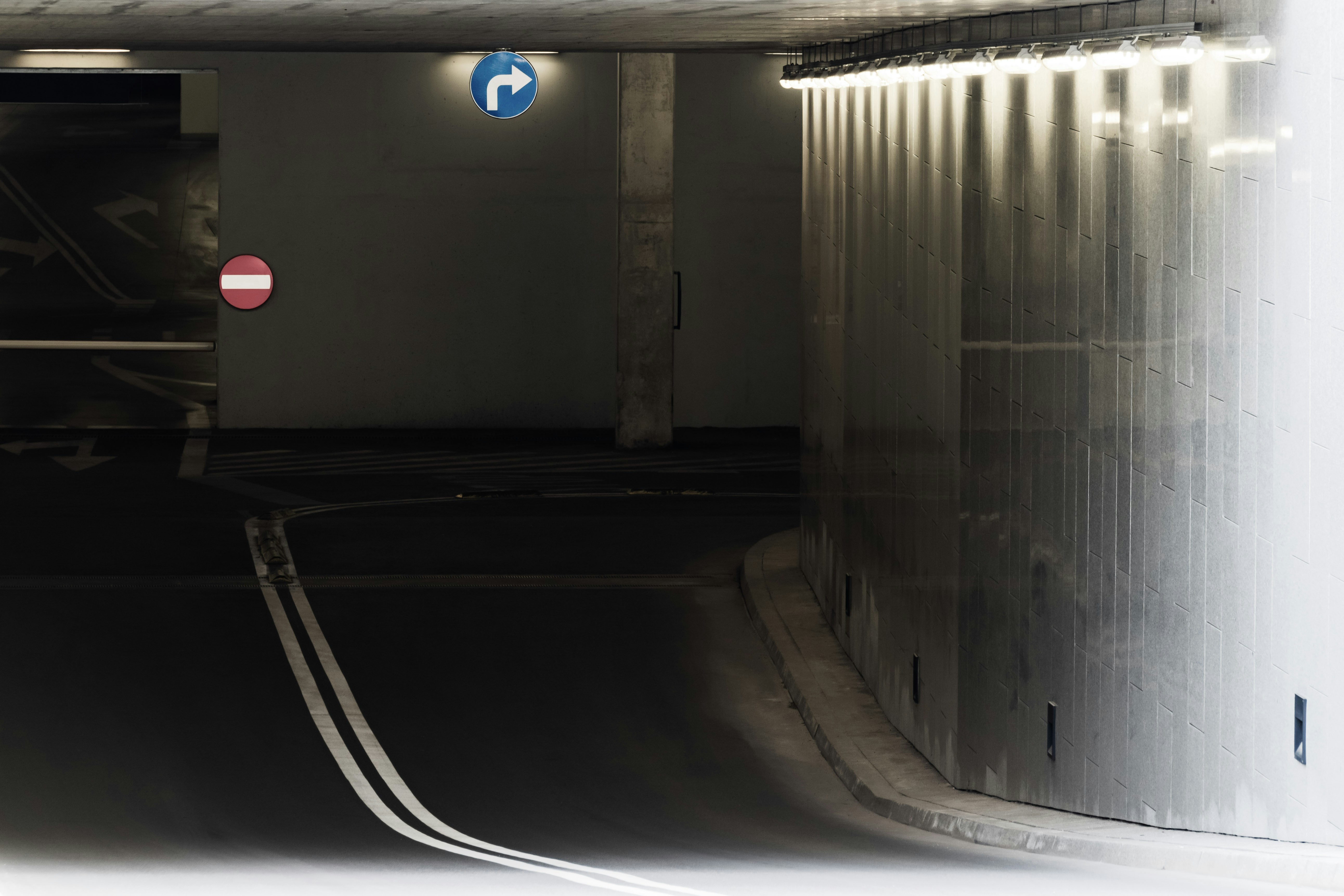 Mechanic inspecting the frame and suspension of a used truck on a lift
