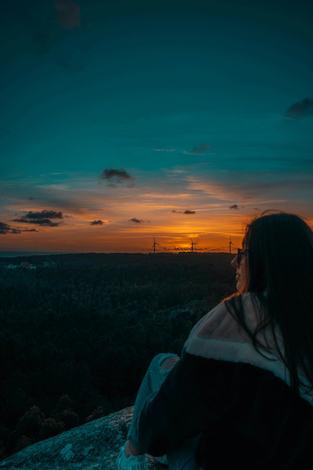 woman sitting on the ground during golden hour