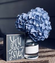 blue flowers in glass vase