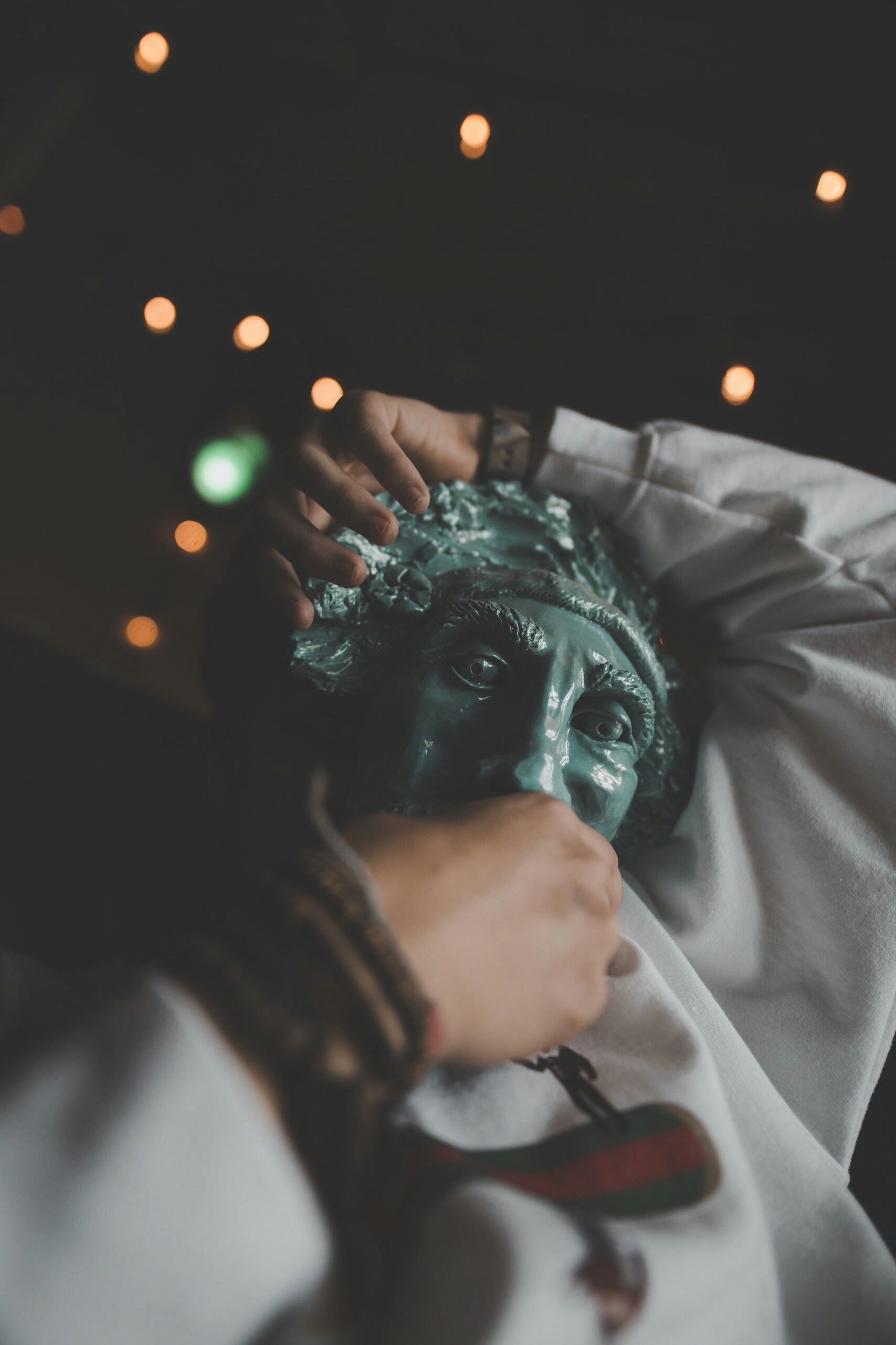 Person holding green face mask outsidde photo Free Southern muggs