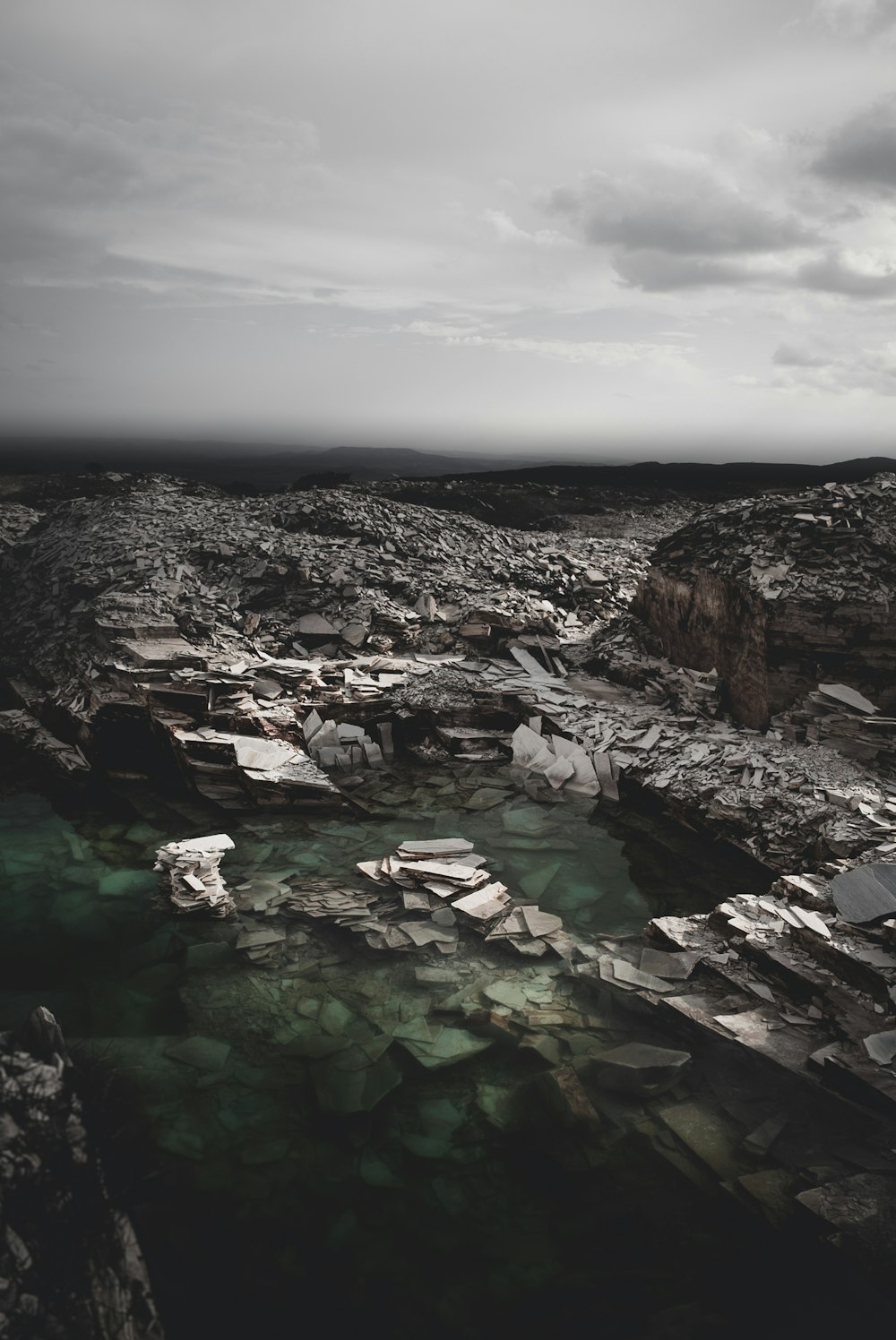 gray stones with body of water digital wallpaper