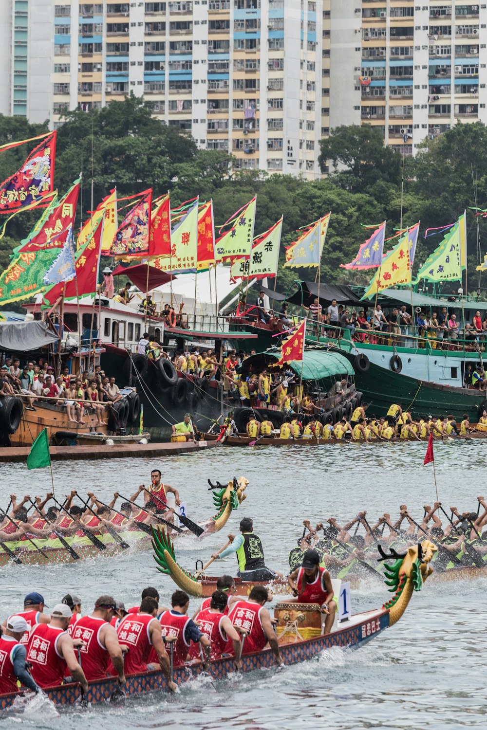 group of people riding dragon boat on water