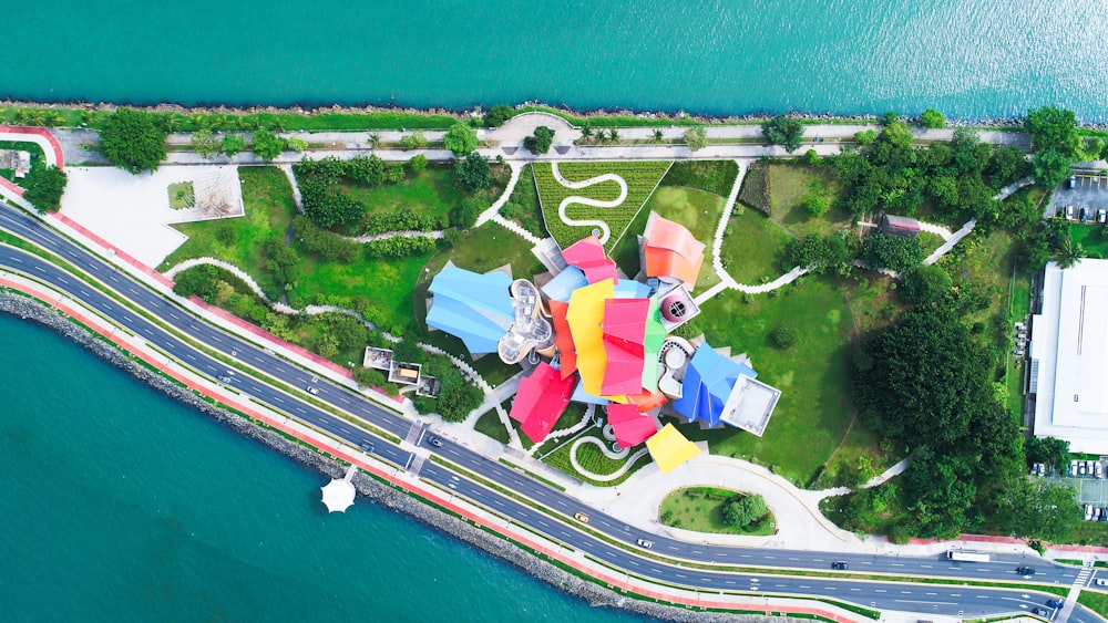 aerial view of multicolored roof building next to road