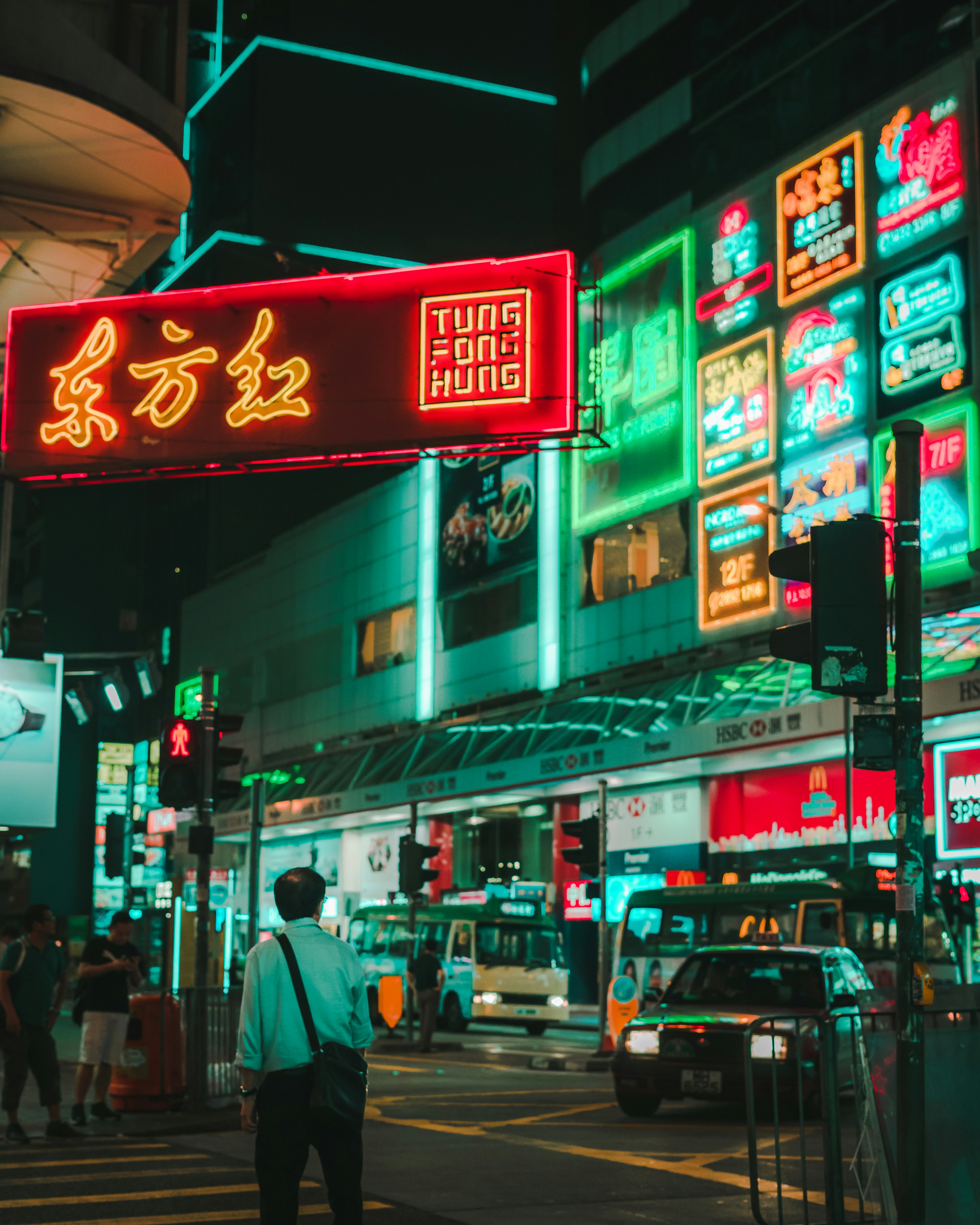 man walking on street under tung fong hung signage photo free human image on unsplash street under tung fong hung signage