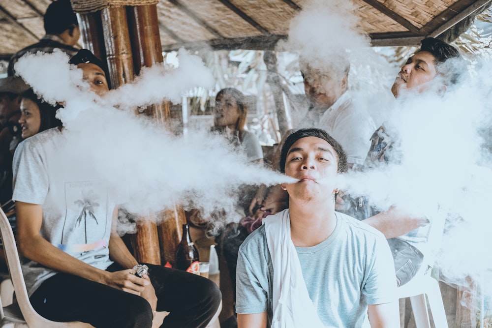 group of people vaping on gazebo