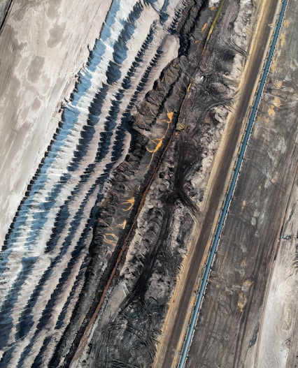 an aerial view of a train track in the desert