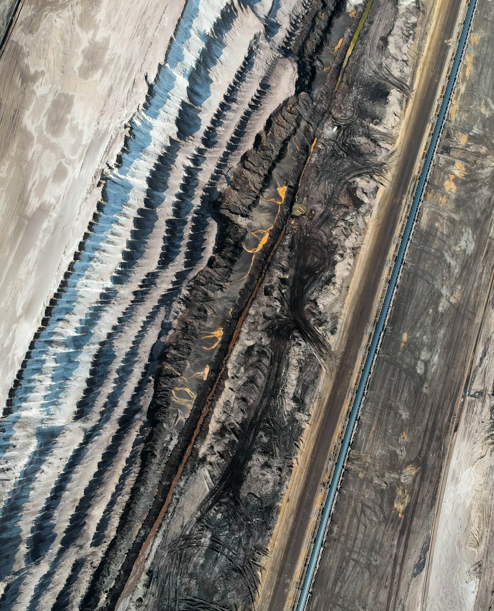 an aerial view of a train track in the desert