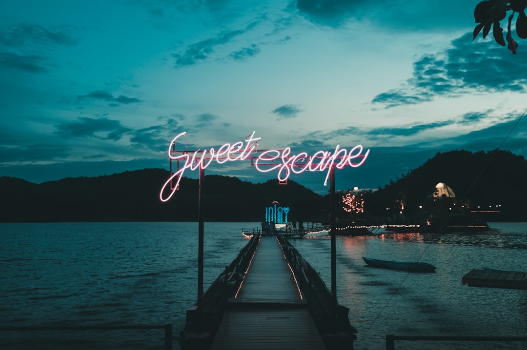 brown wooden harbor dock, sweet escape