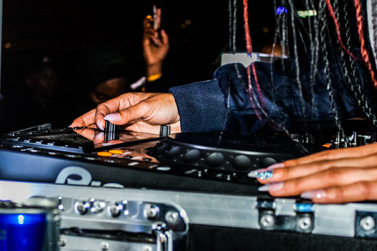 Audience at a live music event with hands raised