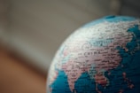 close up photo of blue desk globe