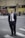 man standing near road next to people during daytime