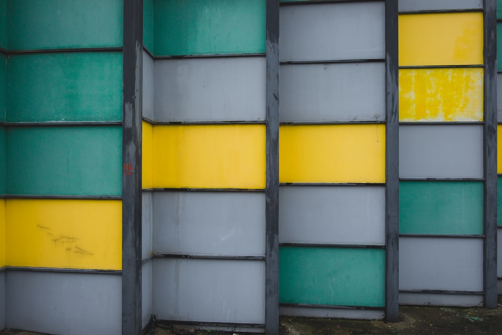 grey, green, and yellow wall closeup photography