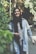 A happy customer wearing a stylish cotton outfit while smiling outdoors.