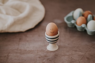 selective focus photography of brown egg egg teams background