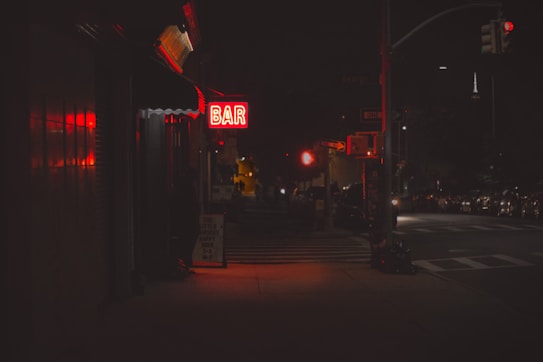 lighted bar signage during nighttime