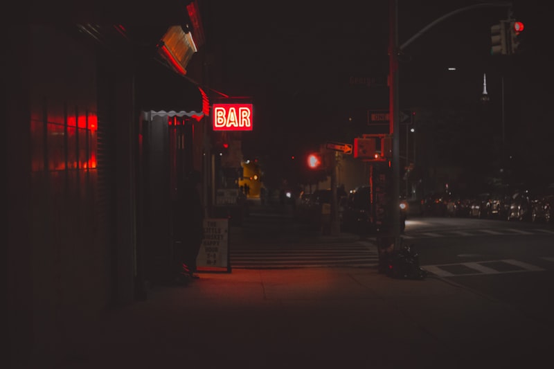 Phone screen with contact number, finger hovering