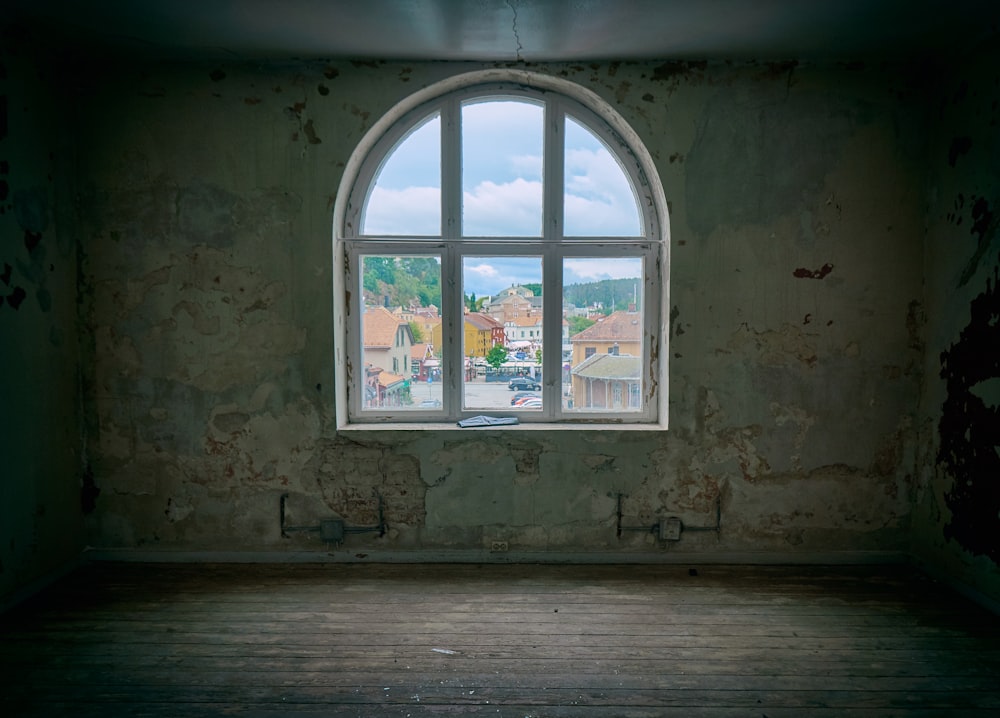 clear glass window inside wood parquet floor