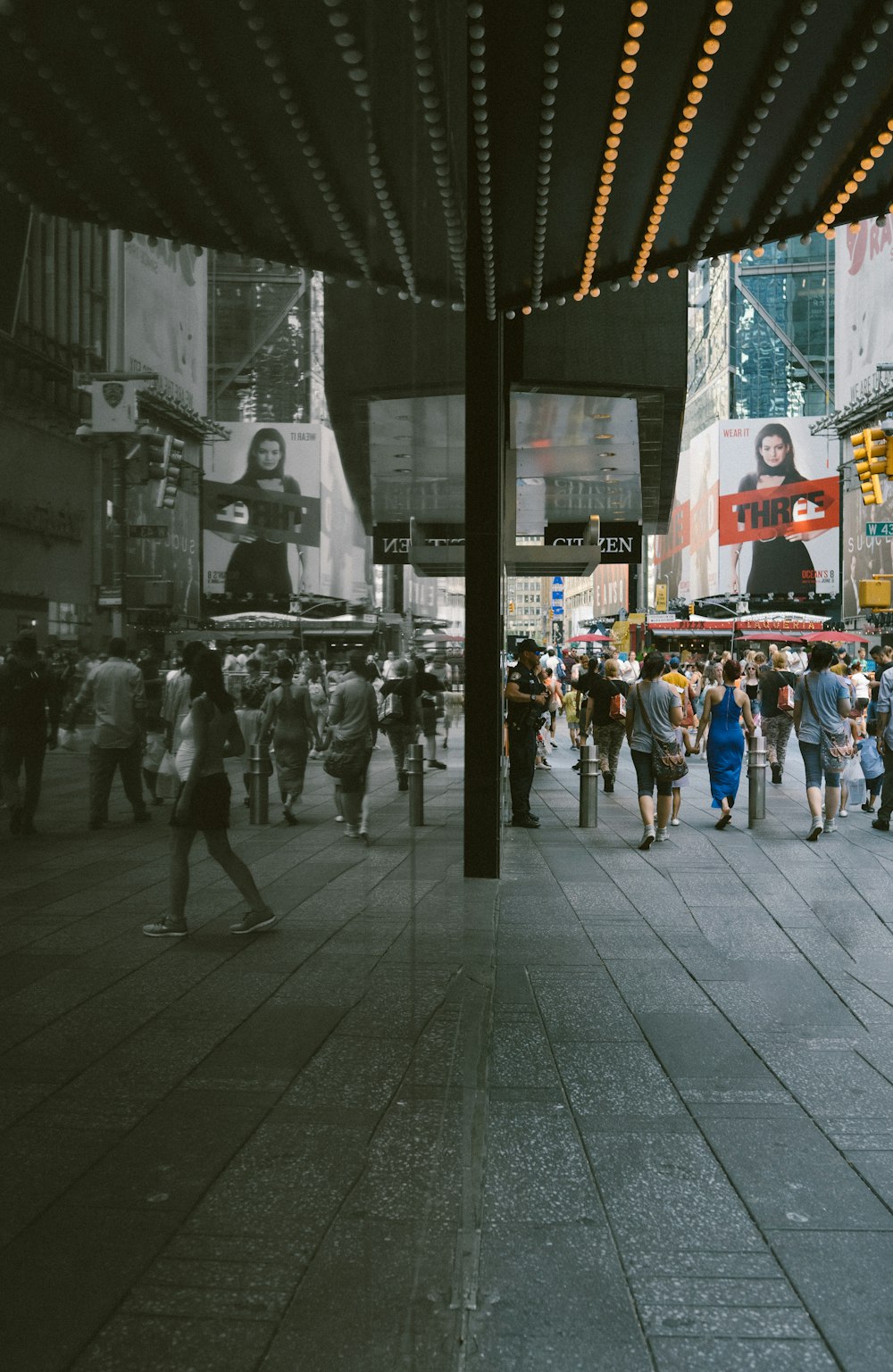 people walking beside building