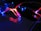 A string of decorative LED lights emitting red and blue light. The lights are intertwined, creating a vibrant and dynamic visual effect against a dark background. The glow of the lights reflects off the nearby surfaces, enhancing the vivid colors.