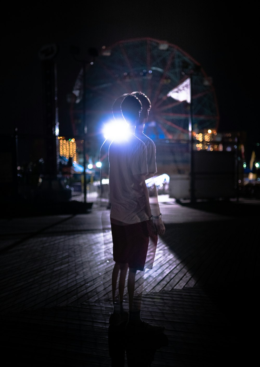 photo of man standing on street