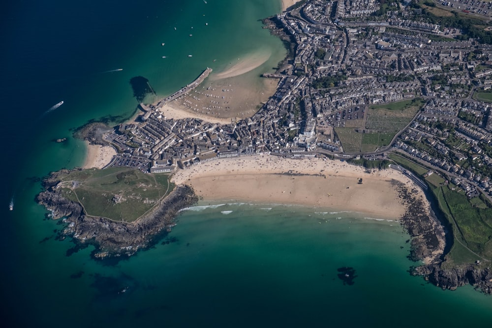 bird's eye view photography of a city near body of water