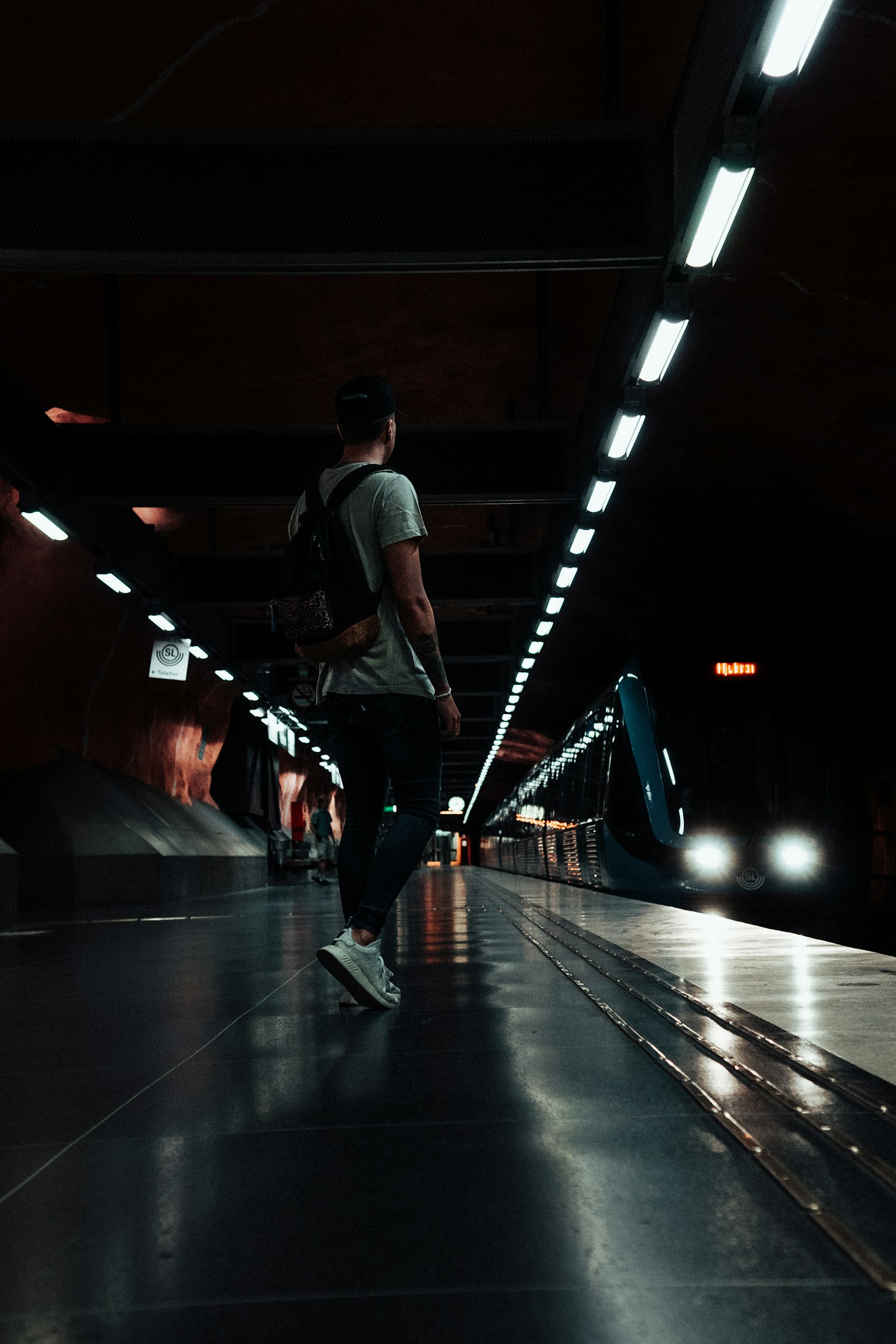 Sony a7 II + Sony E 35mm F1.8 OSS sample photo. Man standing at train photography