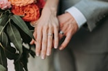 couple wearing silver-colored rings
