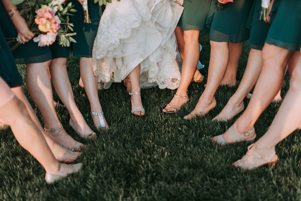 photography of womens on green grass during daytime