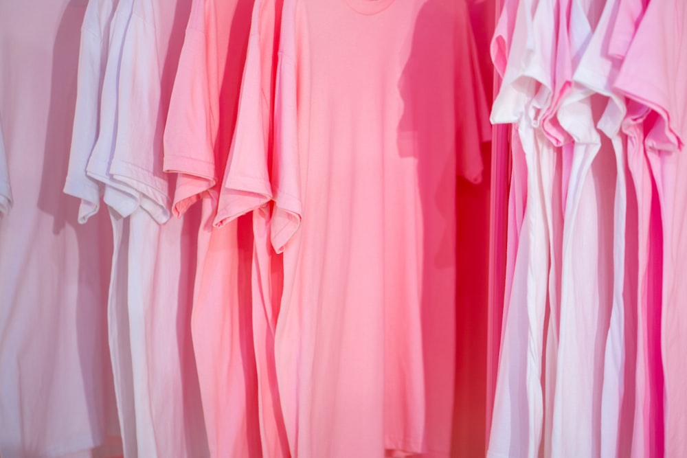photo of white and pink t-shirts