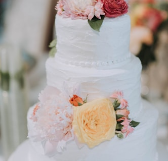 round white icing-covered 3-layer cake