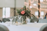 pink flowers in clear glass vase