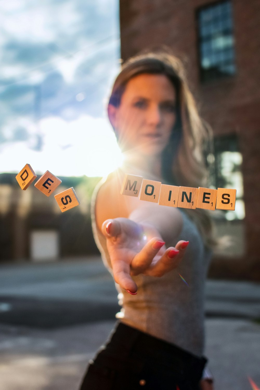 selective focus photography of woman throwing scrabble tiles
