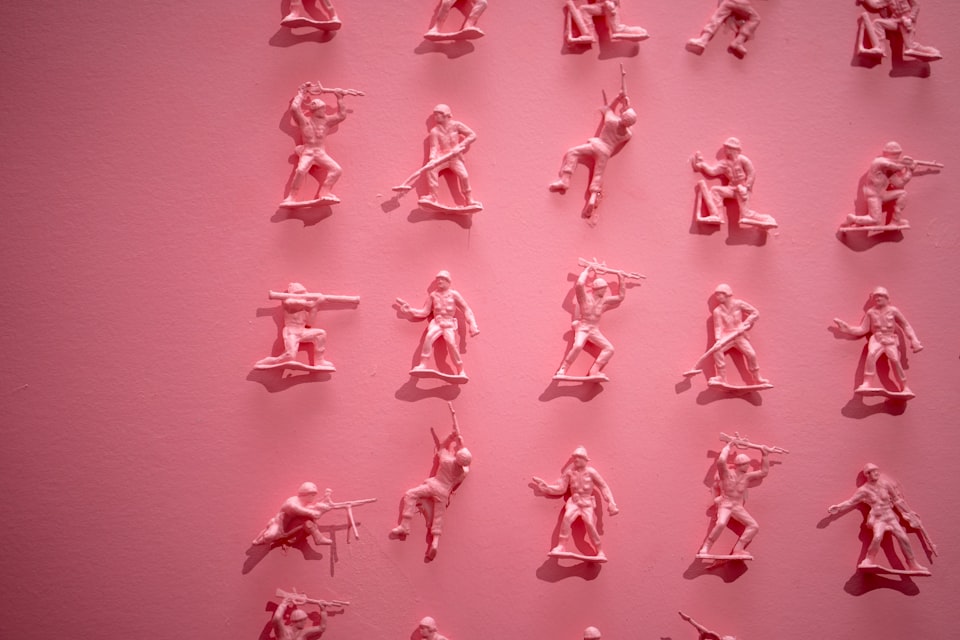 A collection of pink plastic soldiers