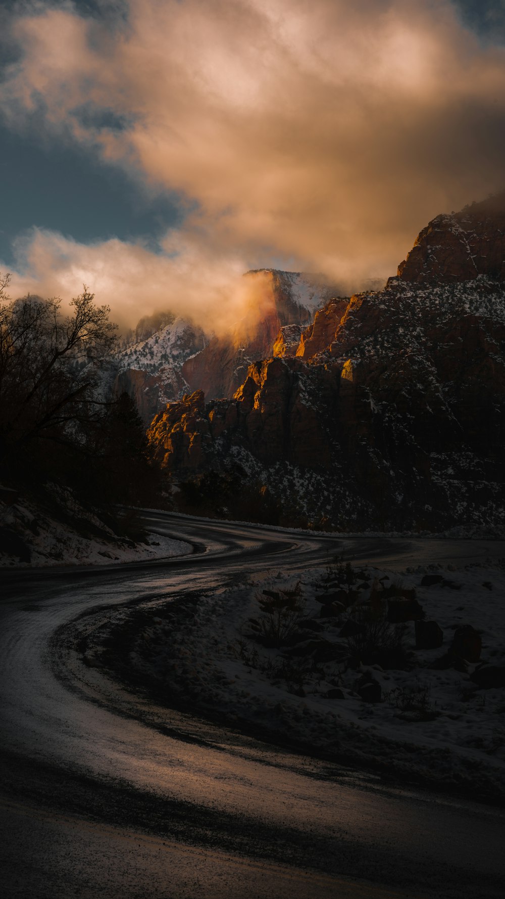 roadway in the middle of rocky mountains