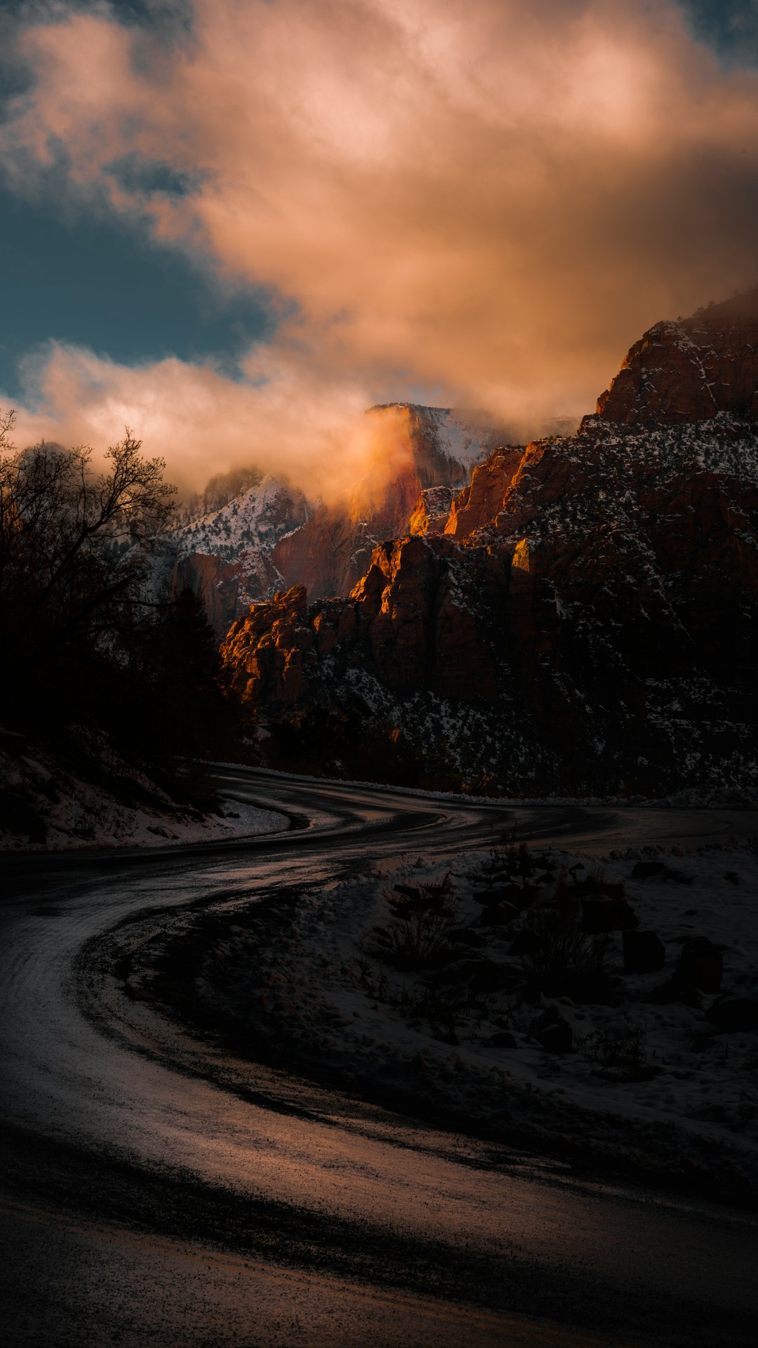 roadway in the middle of rocky mountains