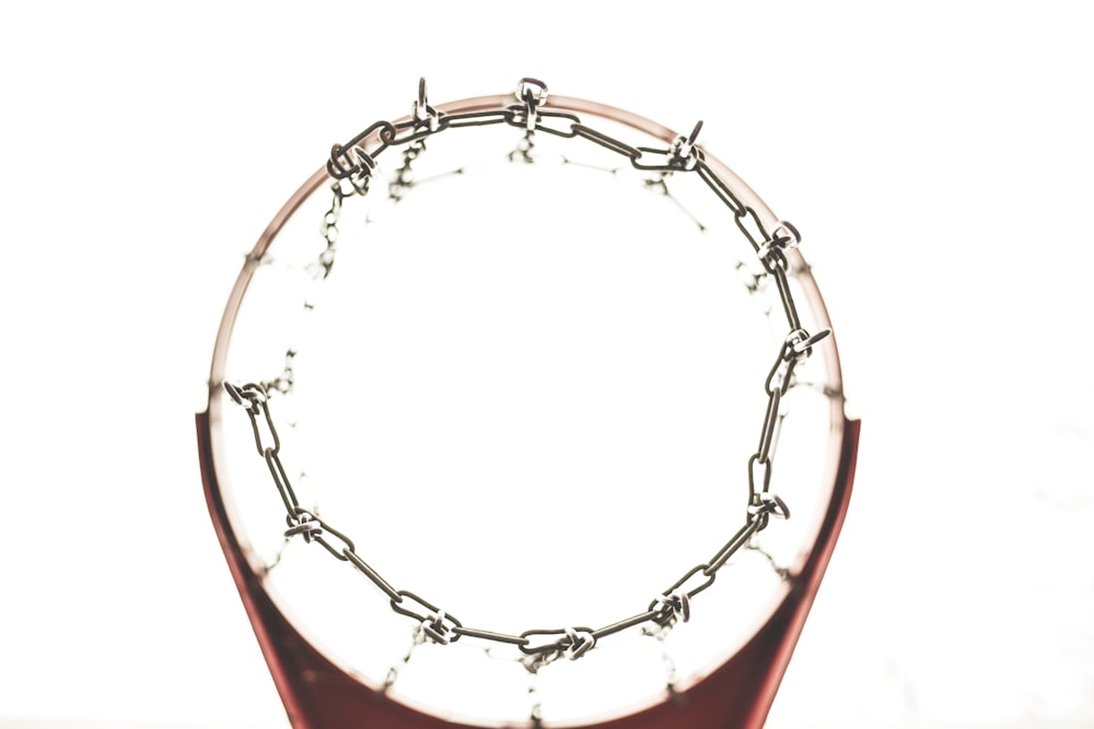 red and gray metal chain net basketball hoop