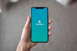 person holding space gray iPhone X