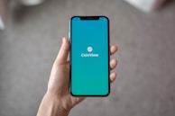 person holding space gray iPhone X
