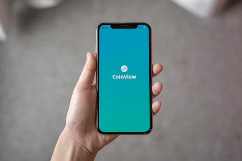 person holding space gray iPhone X